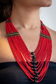 Beautifull red layered necklace that is a true eye catcher. These nepalese traditional craftmanship necklaces (Mala) are made with a modern touch. A "pote" is a traditional nepali necklace made by stringing small cut (glass) beads. This necklace is designed in a trending long style and is durable and skin friendly. Red Fair Trade Jewelry With Round Beads, Fair Trade Red Jewelry For Festivals, Red Fair Trade Jewelry For Festivals, Multi-strand Fair Trade Festival Jewelry, Multi-strand Fair Trade Jewelry For Festivals, Fair Trade Multi-strand Festival Jewelry, Artisan Red Fair Trade Necklace, Red Beaded Necklace For Rituals, Handmade Red Necklace For Puja