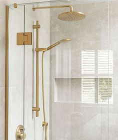 the shower head and handset are gold in color