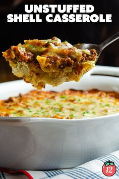 a casserole dish with meat and cheese in it being lifted by a spoon