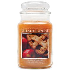 a jar filled with an apple pie candle