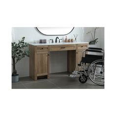 a bathroom with a sink, mirror and wheel chair