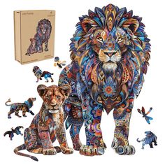 the lion and cub figurines are in front of an open box with its contents