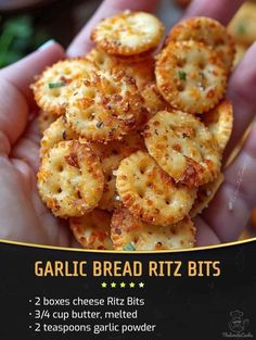 garlic bread ritz bits are in the palm of someone's hand