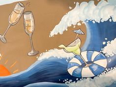 a painting of two champagne glasses and an inflatable floater on the beach