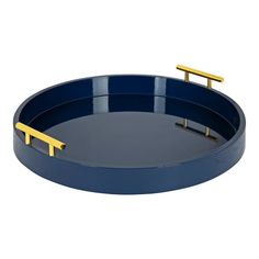 a blue and gold tray with two handles on the bottom, sitting on a white surface