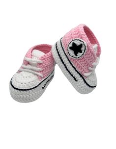 We are make for a cute and cozy accessory for a baby! 🧶 Charming crocheted baby sneaker like the Converse all-star.  The craftsmanship is delightful, with the little details like laces and the stitching around the sole. A cool shape with the well-known all-star emblem 🥰  It's adorable how these tiny shoes mimic the style of classic sneakers, complete with the white toe cap and contrasting trim. These amazing and cute booties are a perfect gift for a baby shower, Mother's Day, Christmas, etc.🎁  Suitable for babies from 3-6-9 months old (Every baby's foot is different. Please make sure to measure your baby's foot. ). I can make them in many different colors, but the nose and the sole are always white for the Converse.  💌For custom orders and requests please be welcome to contact me (For Christmas Gift Baby, Cool Shapes, Cozy Accessories, Contrasting Trim, Baby Sneakers, Baby Crib, Crib Shoes, Classic Sneakers