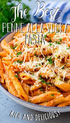 the best penne alla vodka pasta with parmesan cheese and parsley on top