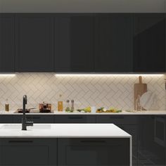 a kitchen with black cabinets and white counter tops