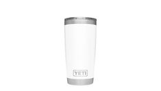 the yeti travel mug is white and has a silver trim around the bottom half