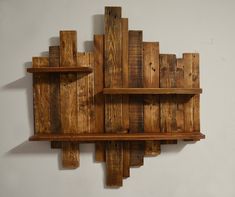 a wooden shelf with shelves made out of wood planks on the top and bottom