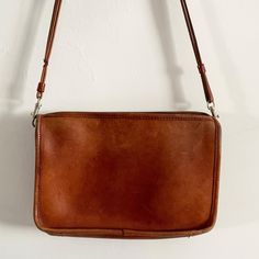 Description:  Vintage Tan Leather Piped Simple Double Strap Shoulder Bag Removable Strap. One Pocket. Zip fastening. Few Marks. Measurements: H: 19cm, W 28.5cm, Bag to Strap: 54cm Tan Shoulder Bag, Sling Bags, Tan Leather, Cross Body Handbags, Purses And Handbags, Labour Day, Cross Body, Crossbody Bags, Accessory Gift