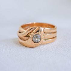 An exquisite  French 18K rose gold serpent snake ring with European cut head. The body of the snake wraps around the finger twice and the tail elegantly curls around the finger. The band is smmith sold and comfortable for everyday.  Beautifully modern feel, it's a ring that makes a statement when worn.  The snake has come to be revered by countless cultures to represent the cycle of rebirth and new beginnings.   When Prince Albert proposed to Queen Victoria with a snake ring, the trend was popul Queen Victoria, Serpent Snake, Middle Finger Ring, Prince Albert, Snake Ring, The Snake, A Snake, European Cut Diamonds, Finger Ring