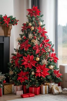 a christmas tree decorated with red and gold poinsettis