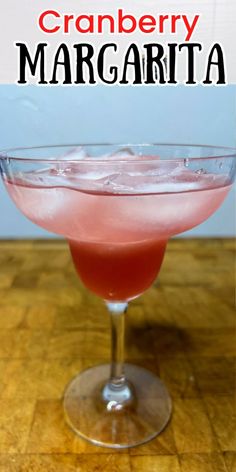 cranberry margarita in a coupe glass on a wooden table with text overlay