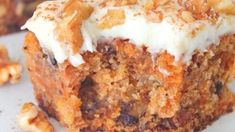 a close up of a muffin on a plate with walnuts around the edges