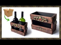 two wine bottles in a wooden box with an ornament on the top and bottom