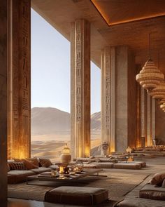 the inside of a large building with columns and couches