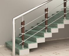 a set of stairs with handrails and tile flooring