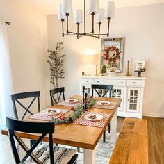 the dining room table is set with place mats and placemats for christmas dinner