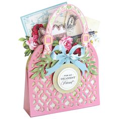 a pink card holder with flowers, cards and a bow on the front that says dearest friend