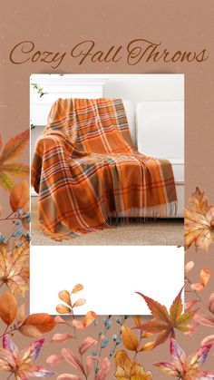 an orange plaid blanket sitting on top of a bed