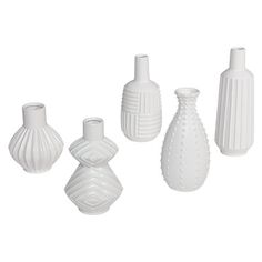 four white vases are shown on a white background