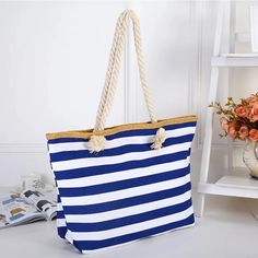 Stay Stylish and Organized with This Versatile Tote Make your summer days effortless with the Women’s Large Striped Beach Tote Shoulder Bag. Whether you're heading to the beach, taking a shopping spree, or embarking on a travel adventure, this bag is your ultimate companion. Its spacious interior accommodates all your essentials, while the soft yet durable canvas exterior makes it lightweight and comfortable to carry. With an eye-catching striped pattern in a variety of vibrant colors—red, navy, Beach Accessories, Woman Beach, Beach Tote, Canvas Shoulder Bag, Primavera Estate, Cigars, Beach Bag, Shoulder Bag Women, Tote Handbags