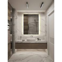 a modern bathroom with marble counter tops and lights above the sink, along with an illuminated mirror