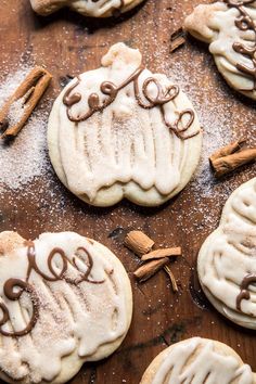 some cookies are decorated with icing and cinnamons