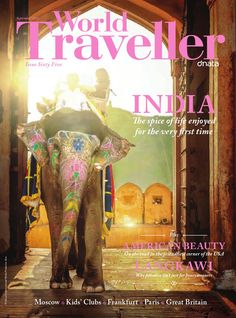 the front cover of world traveler india, featuring an elephant with people riding on its back