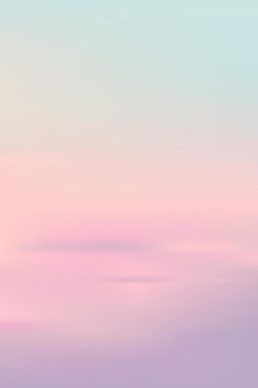 an airplane flying in the sky with pink and blue clouds behind it at sunset or sunrise