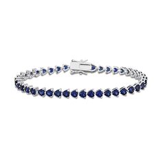 Express your romantic style with this lovely heart-shaped blue lab-created sapphire tennis bracelet in silver. Crafted in sterling silver This design glistens with a vibrant row of sideways 4.0mm heart-shaped bright blue lab-created sapphires. This choice adds a pop of color to your attire. The 7.5-inch bracelet secures with a tongue and groove clasp. Sapphire Tennis Bracelet, Bracelet In Silver, Peoples Jewellers, Tongue And Groove, Sapphire Stone, Bracelet Clasps, Stone Heart, Romantic Style, Blue Heart