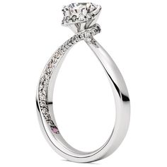 a white gold engagement ring with diamonds on the side