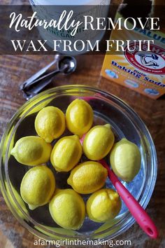 lemons in a glass bowl with the words naturally remove wax from fruit