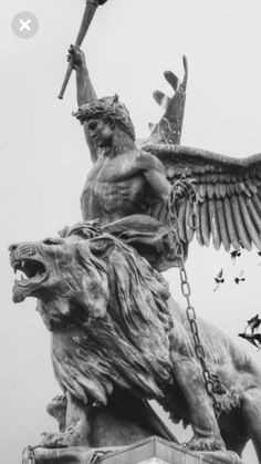 an image of a statue with wings on it