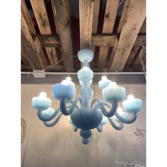 a blue chandelier hanging from the ceiling