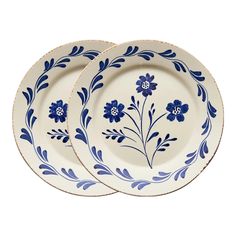 a blue and white plate with flowers on it