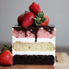 there is a piece of cake with strawberries on top