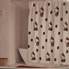 a hello kitty shower curtain in a bathroom