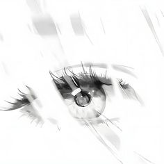 an eye with long lashes is shown in black and white