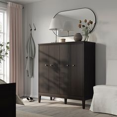 a bedroom scene with focus on the cabinet