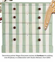 an old dresser painted in green and white stripes with gold details on the top drawer