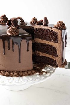 a chocolate cake with one slice missing from it and the rest on top of the cake