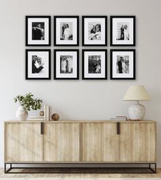 a living room scene with focus on the sideboard and four framed pictures above it