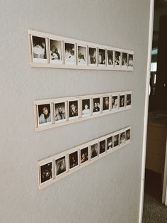 a wall with several pictures hanging on it