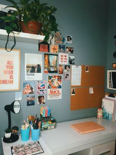 a white desk topped with lots of office supplies