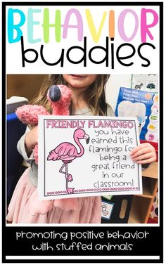 a girl holding up a sign that says, behavor buddies promoting positive behavior with stuffed animals