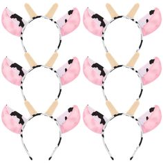 six pink and black cat ears with wooden sticks sticking out of the top, on a white background