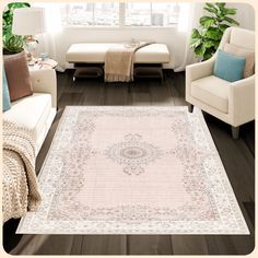 a living room filled with furniture and a rug on top of a hard wood floor