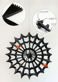 an origami spider web hanging from the ceiling with instructions on how to cut it